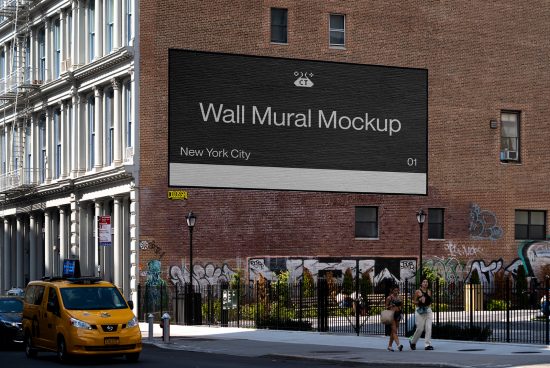 Urban Wall Mural Mockup displayed on a brick building, surrounded by city environment with walking pedestrians, suitable for designers' presentations.